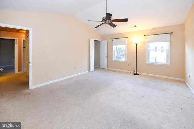 a bath room with a sink vanity tub and shower