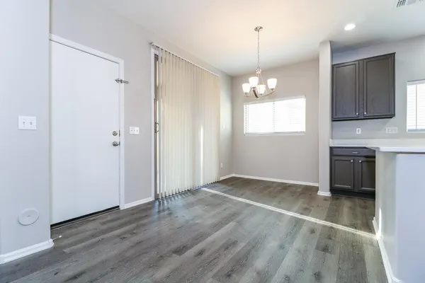 a view of a kitchen and a sink wooden floor