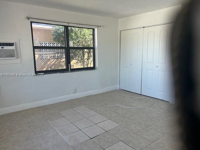 2230 Service Road, Unit 1 Opa-Locka, FL 33054 - Photo 13 of 15 an empty room with windows