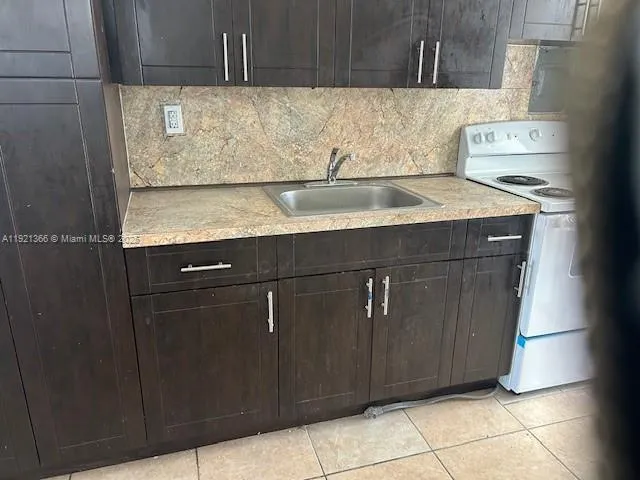 a white bath tub sitting next to a white sink