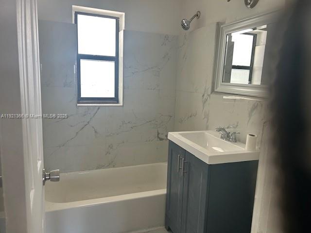 2230 Service Road, Unit 1 Opa-Locka, FL 33054 - Photo 4 of 15 a white bath tub sitting next to a white sink