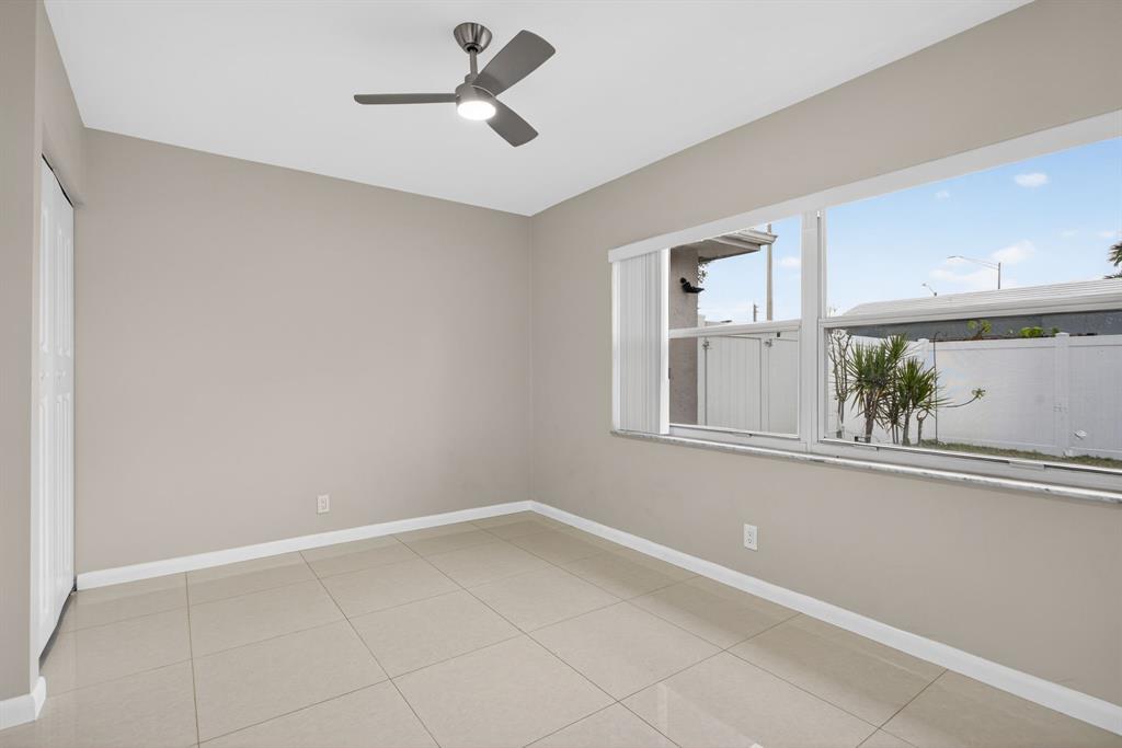 8709 Northwest 57th Drive Tamarac, FL 33321 - Photo 19 of 34 a view of empty room with window and cabinet