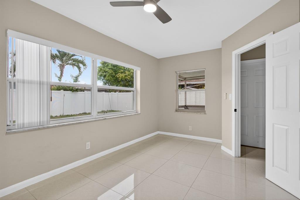 8709 Northwest 57th Drive Tamarac, FL 33321 - Photo 21 of 34 a view of an empty room with a window