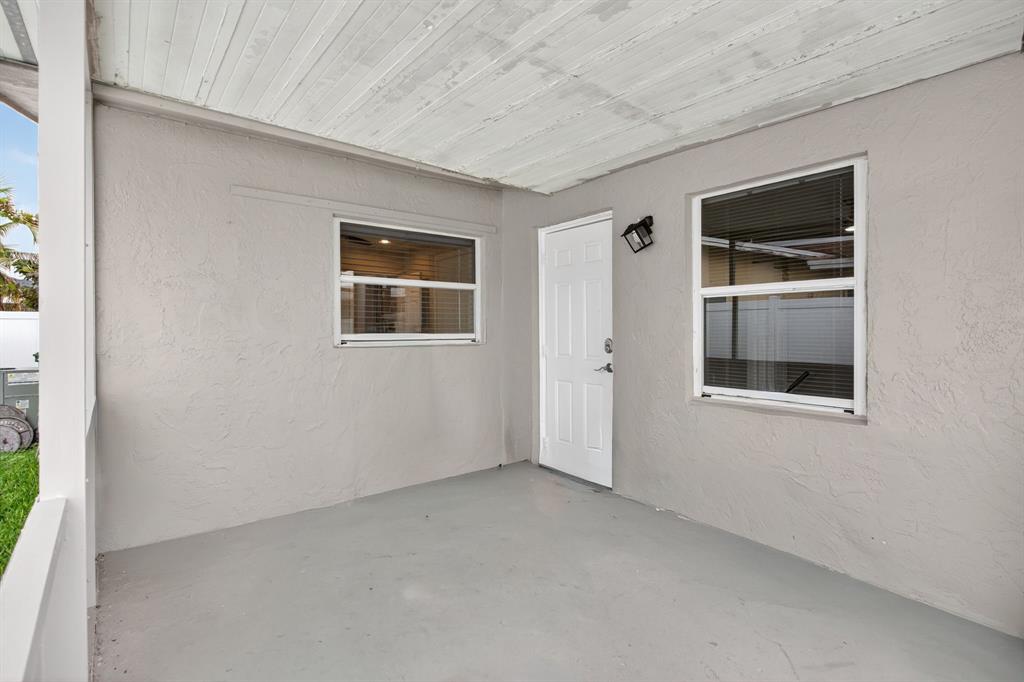 8709 Northwest 57th Drive Tamarac, FL 33321 - Photo 25 of 34 an empty room with windows