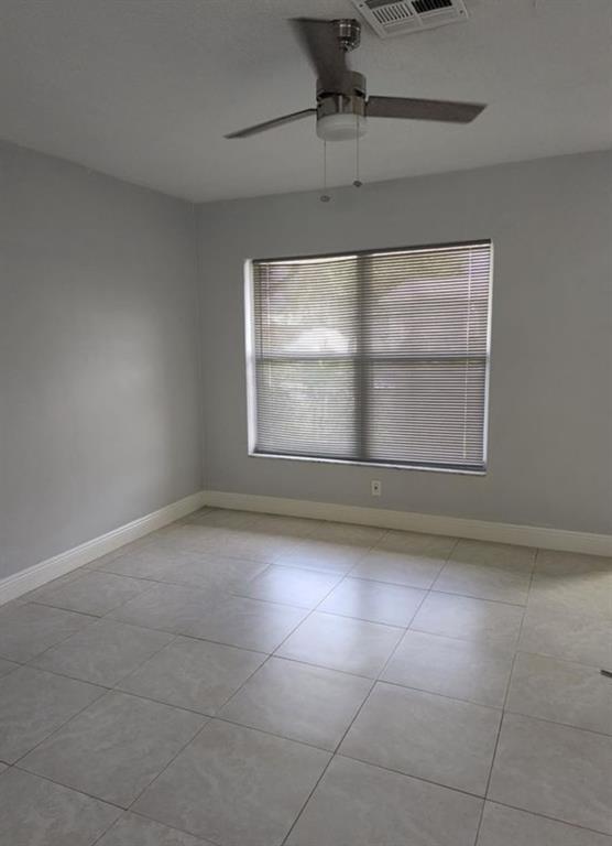 8709 Northwest 57th Drive Tamarac, FL 33321 - Photo 27 of 34 a view of an empty room with a window