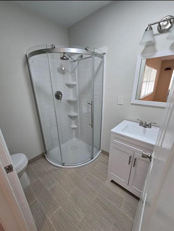 8709 Northwest 57th Drive Tamarac, FL 33321 - Photo 34 of 34 a bathroom with a sink a toilet and shower