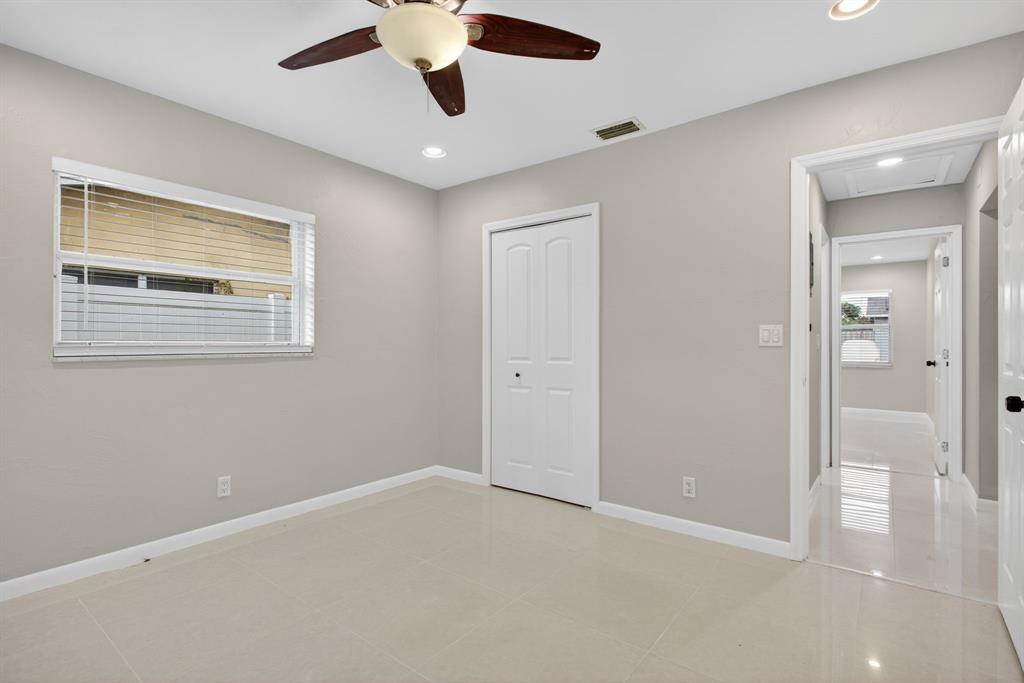 8709 Northwest 57th Drive Tamarac, FL 33321 - Photo 8 of 34 a view of an empty room with a window