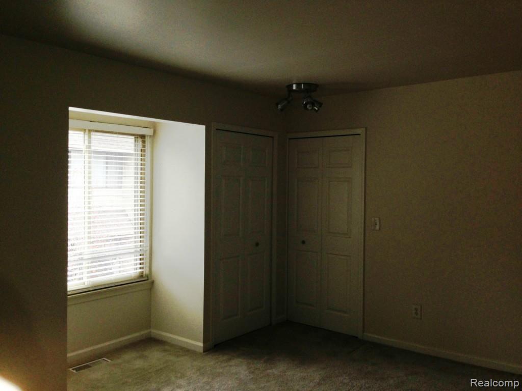 616 Rickett Road, Unit 109 Brighton, MI 48116 - Photo 25 of 38 Master Bedroom II.jpg
