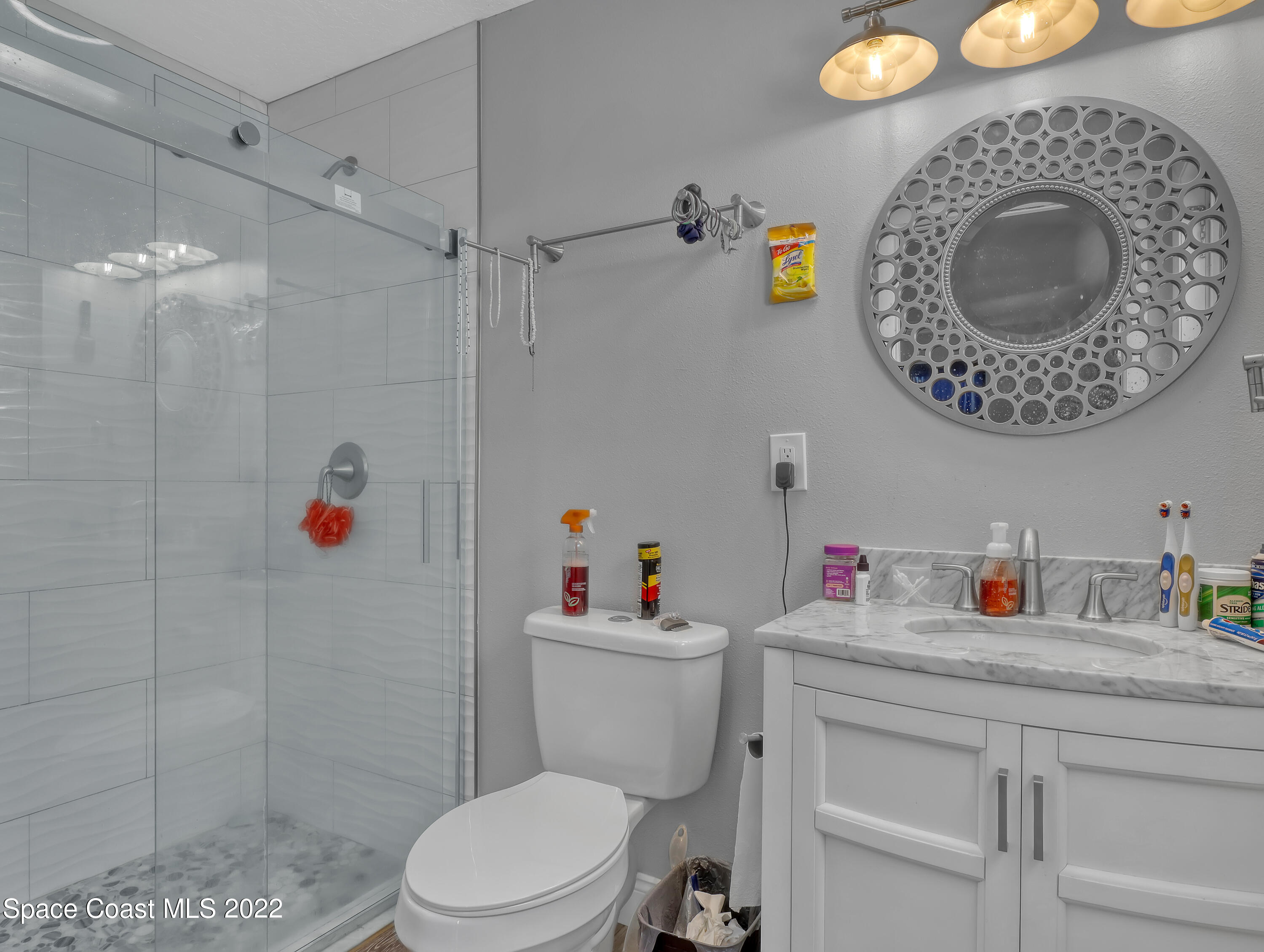765 New Hampton Way Merritt Island, FL 32953 - Photo 22 of 37 a bathroom with a toilet a sink and a shower