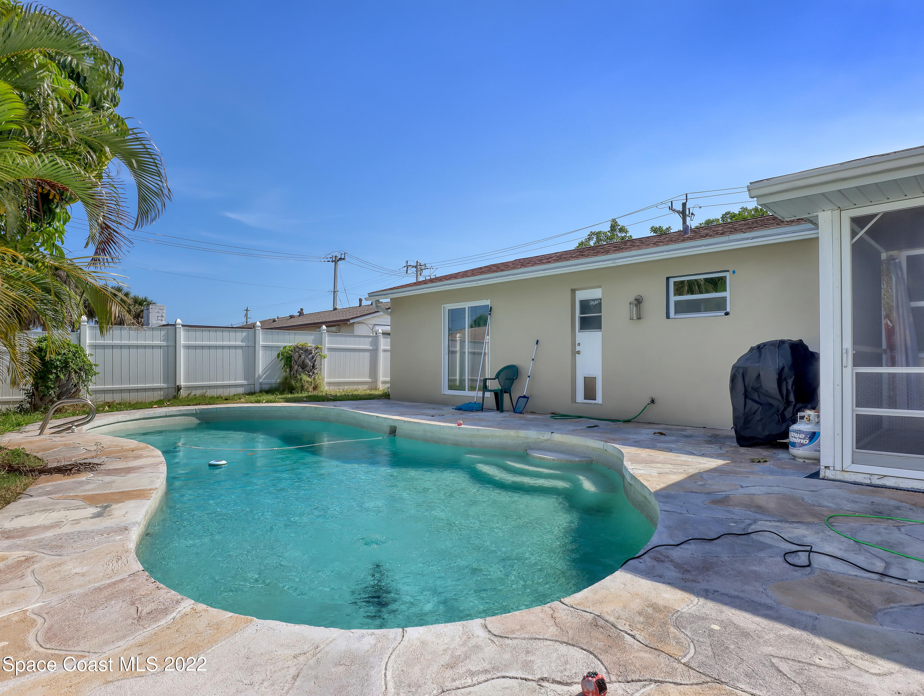 765 New Hampton Way Merritt Island, FL 32953 - Photo 27 of 37 a view of a house with backyard and sitting area