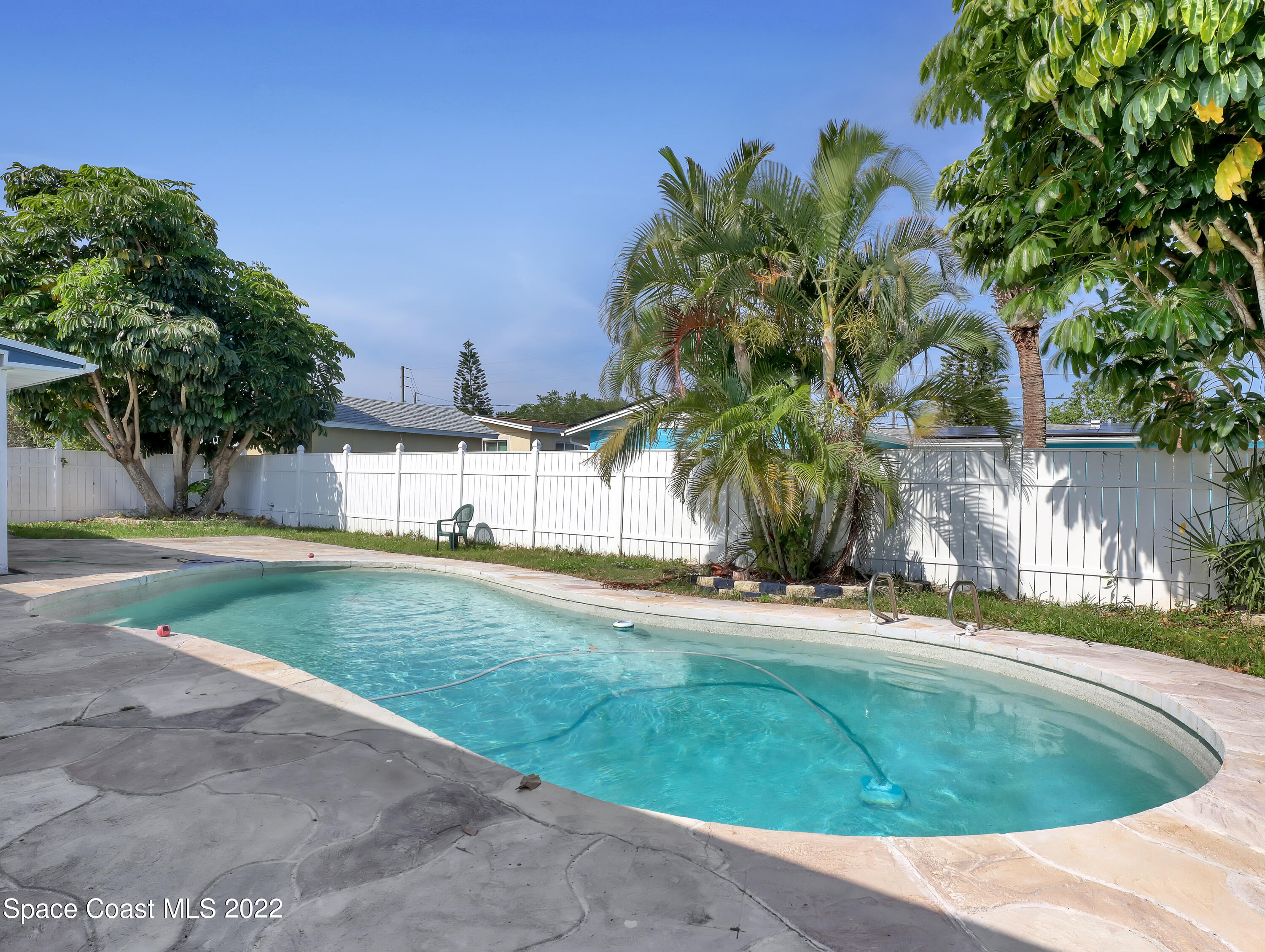 765 New Hampton Way Merritt Island, FL 32953 - Photo 30 of 37 a view of a swimming pool with a yard and plants