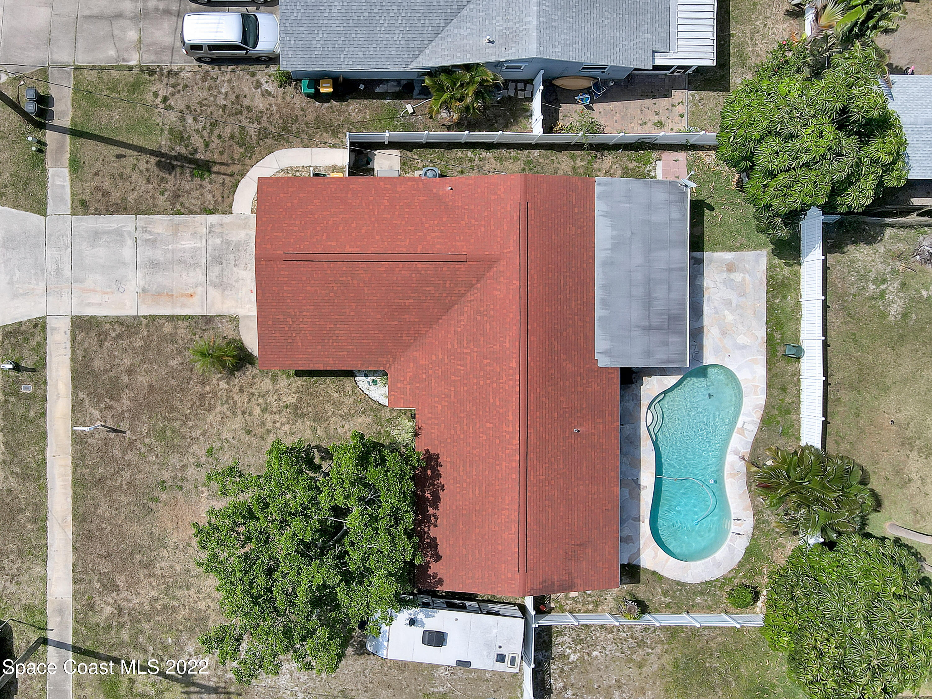765 New Hampton Way Merritt Island, FL 32953 - Photo 36 of 37 an aerial view of a house with garden space and swimming pool