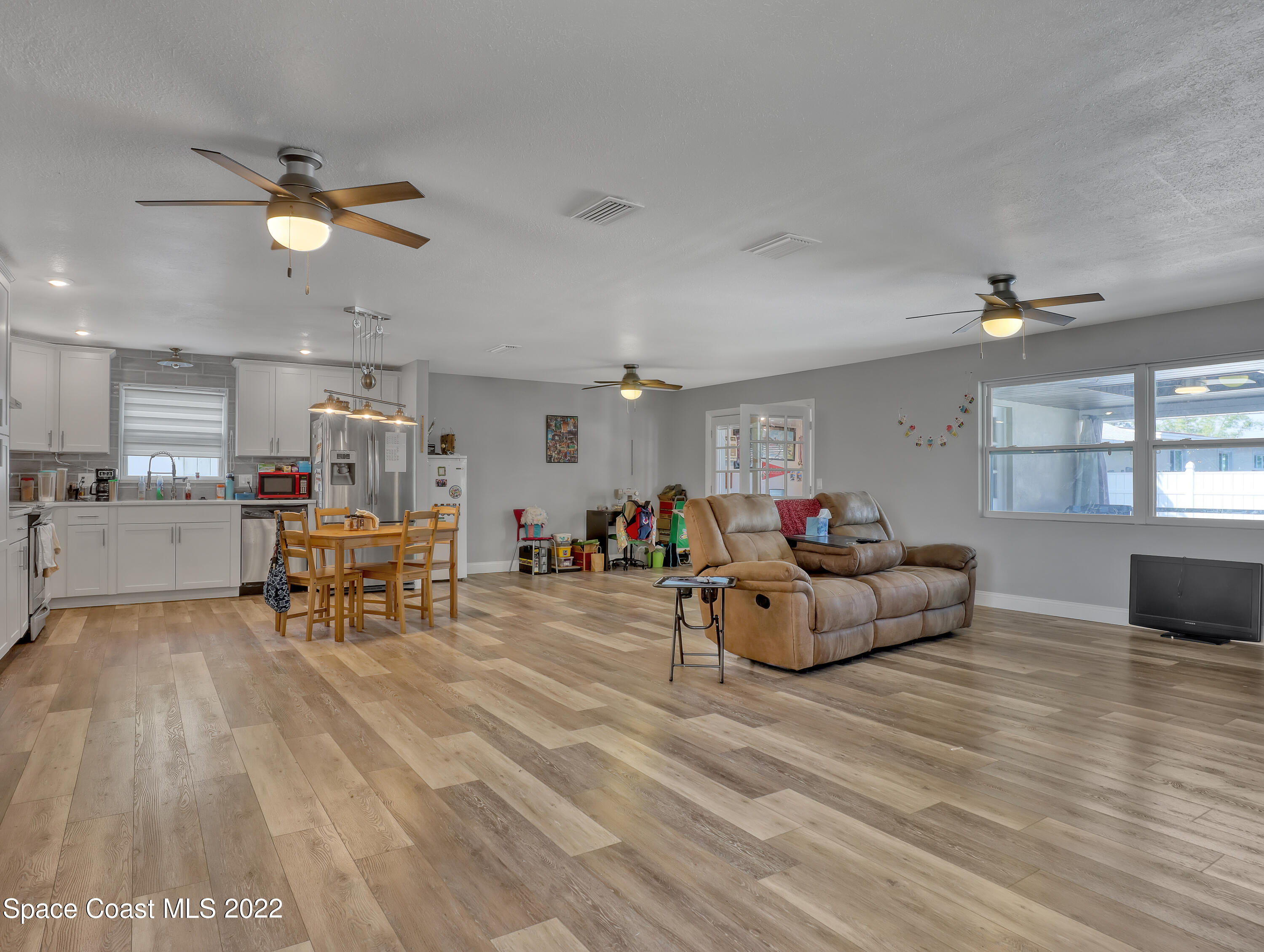 765 New Hampton Way Merritt Island, FL 32953 - Photo 5 of 37 a living room with furniture and kitchen view
