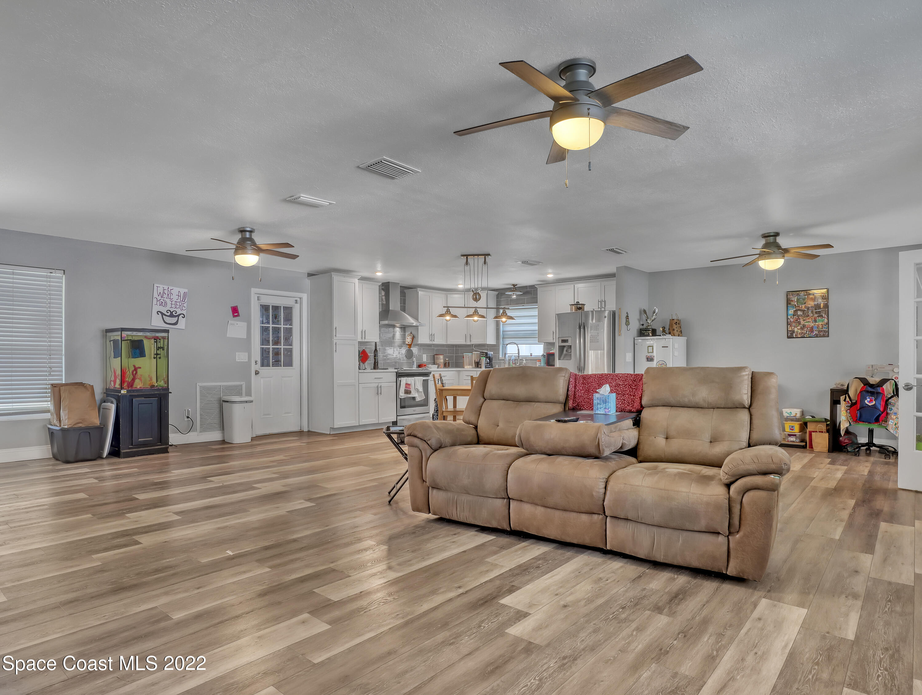 765 New Hampton Way Merritt Island, FL 32953 - Photo 7 of 37 a living room with furniture and a chandelier