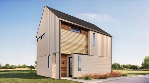 a back view of a house with a yard