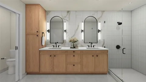 a bathroom with a double vanity sink and mirror with shower
