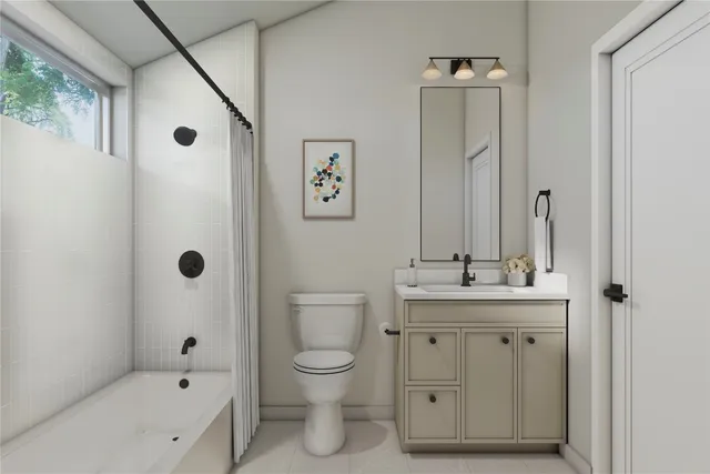 a bathroom with a granite countertop sink a toilet and shower