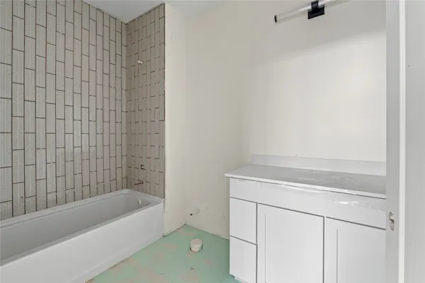 a bathroom with a bathtub