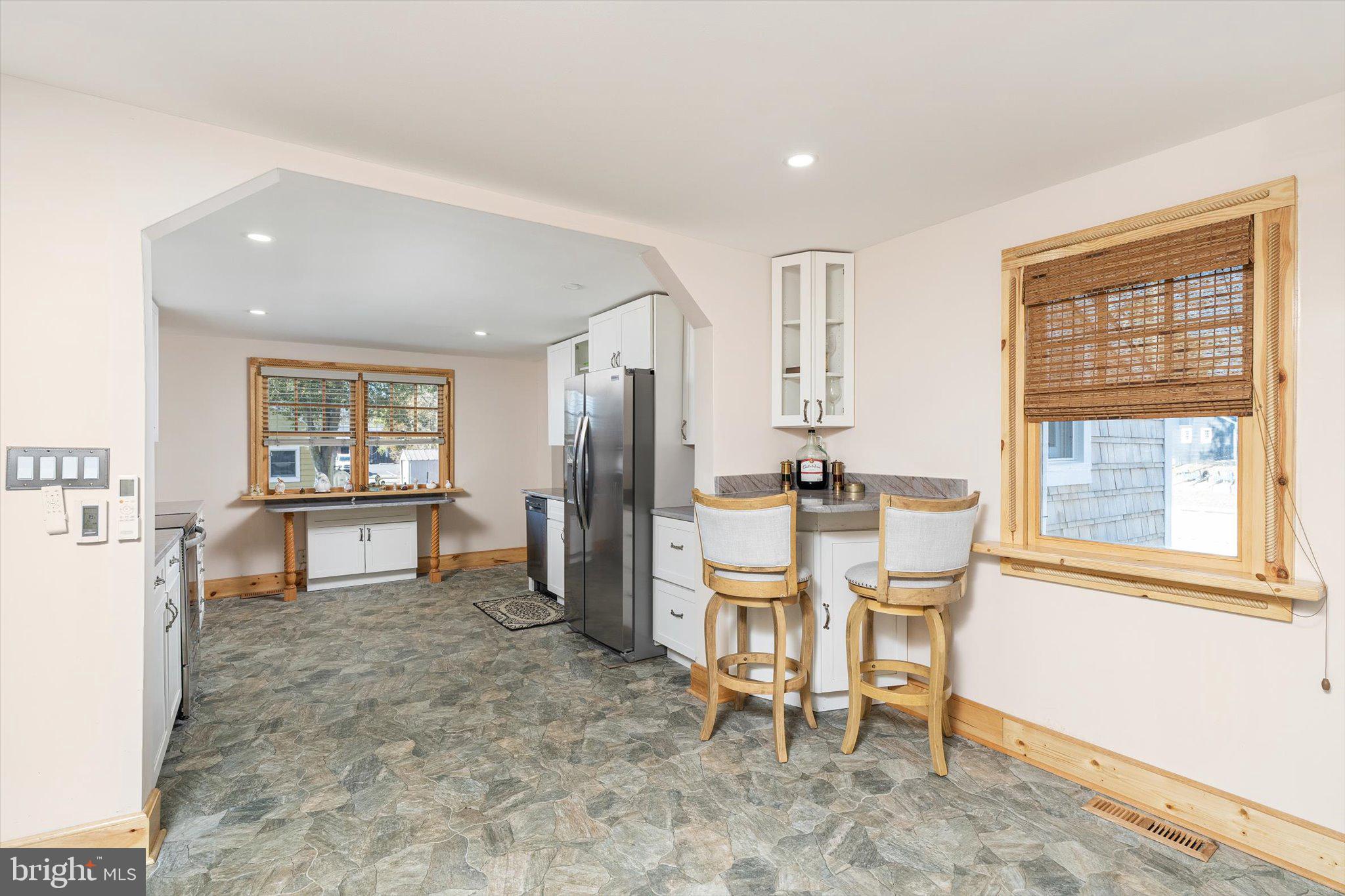 1387 Monmouth Road Mount Holly, NJ 08060 - Photo 11 of 31 a dining room with furniture and a window