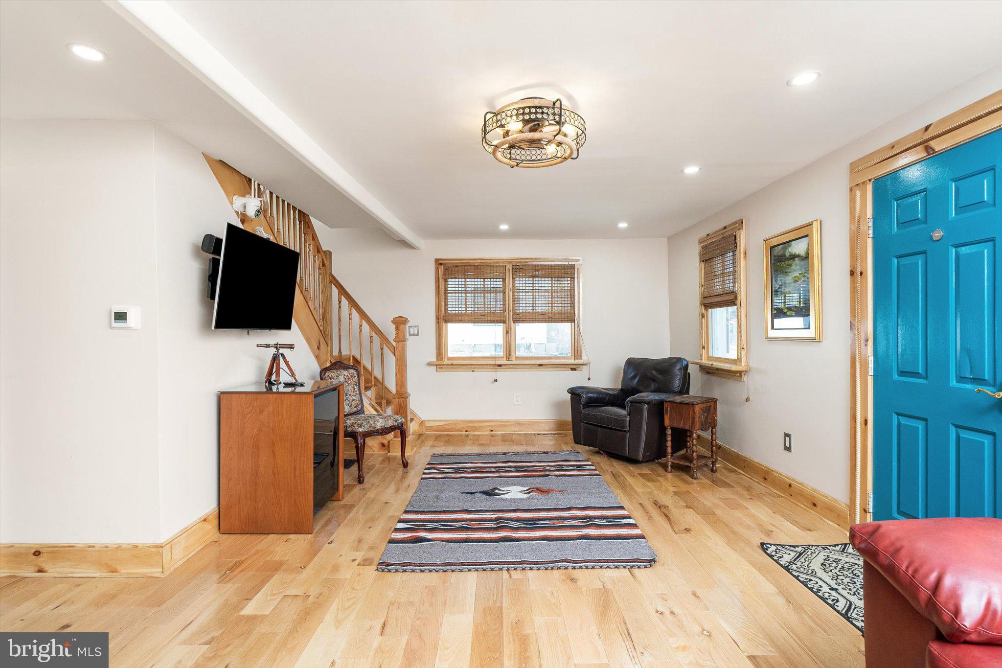 1387 Monmouth Road Mount Holly, NJ 08060 - Photo 3 of 31 a living room with furniture and a flat screen tv
