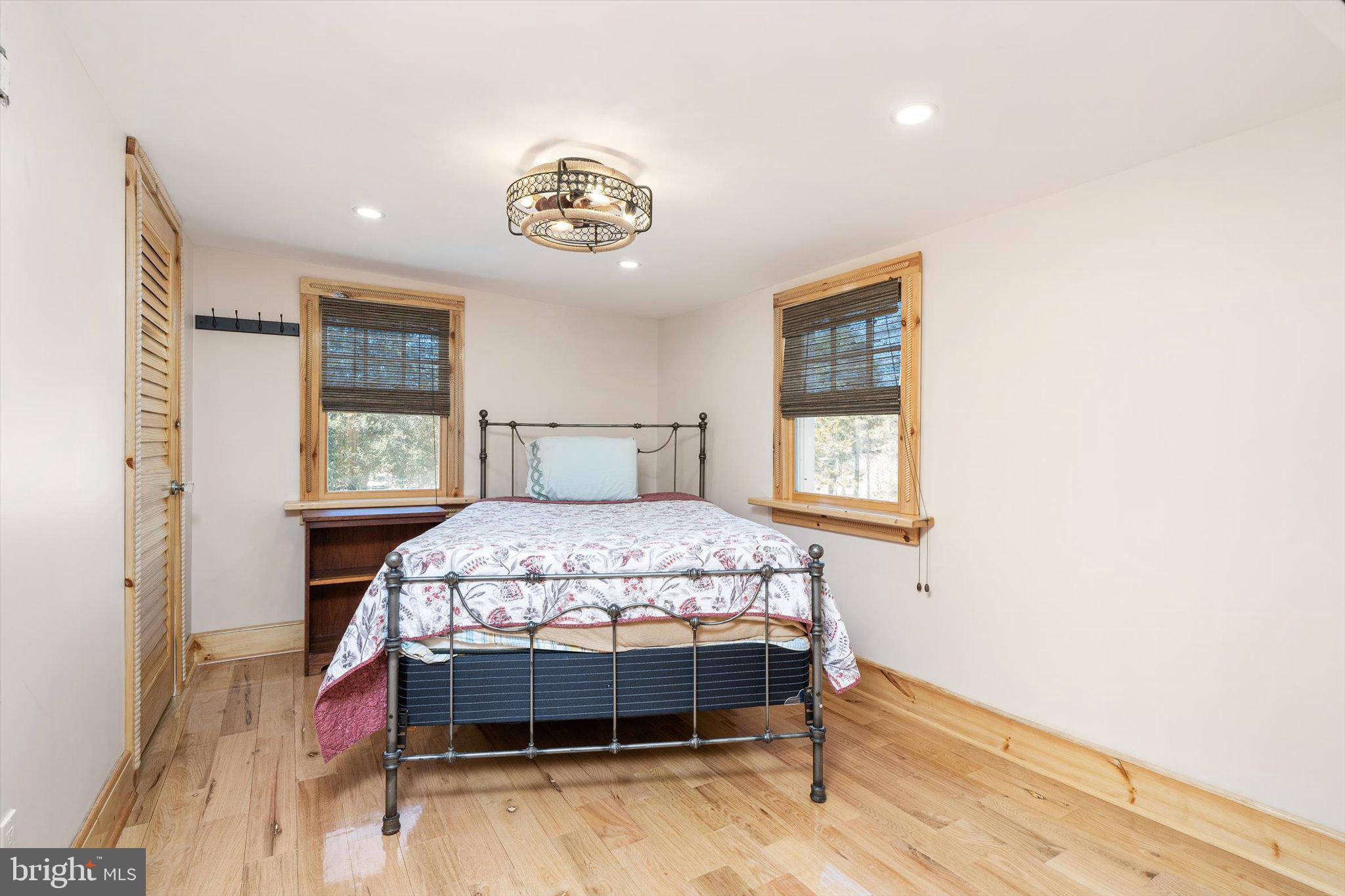 1387 Monmouth Road Mount Holly, NJ 08060 - Photo 9 of 31 a bedroom with a bed and a table