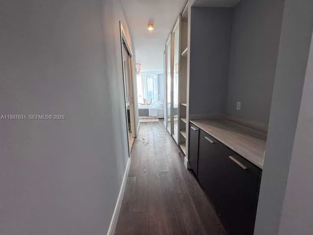 a bathroom with a sink a toilet a mirror and vanity