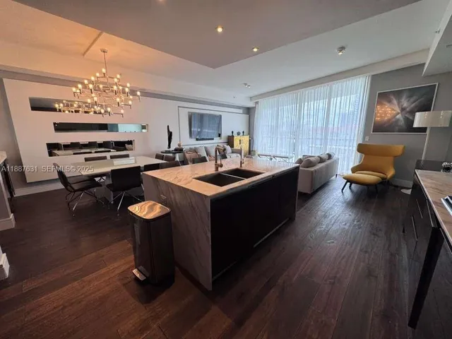 a dining room with a couch table and chairs