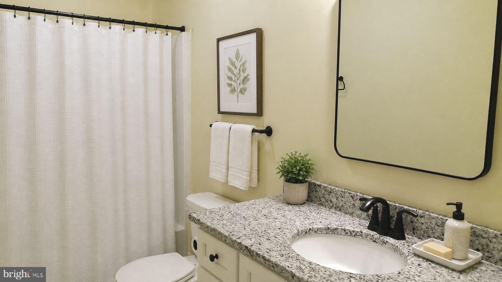 130 Soule Road New Bloomfield, PA 17068 - Photo 6 of 18 a bathroom with a granite countertop sink and a mirror