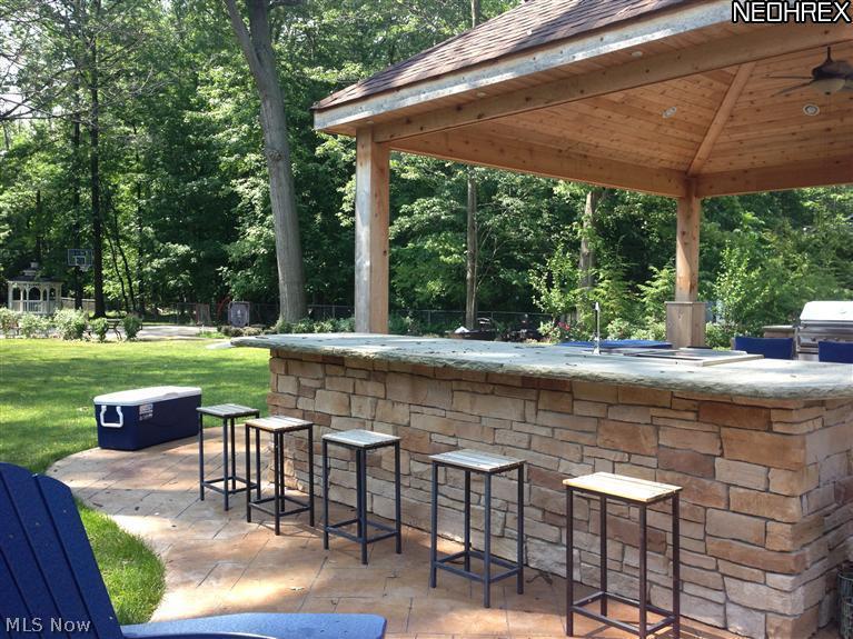 452 Forestview Road Bay Village, OH 44140 - Photo 16 of 24 built-in store bar surrounded by lovely wooded yard