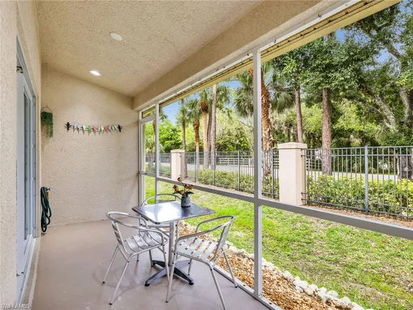 a view of an outdoor dining space with furniture and wooden floor