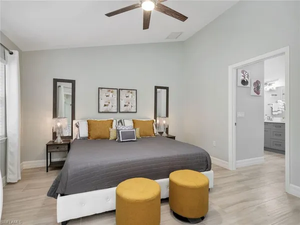 a bedroom with a bed and couch