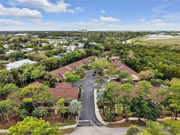 an aerial view of a house with a lake view