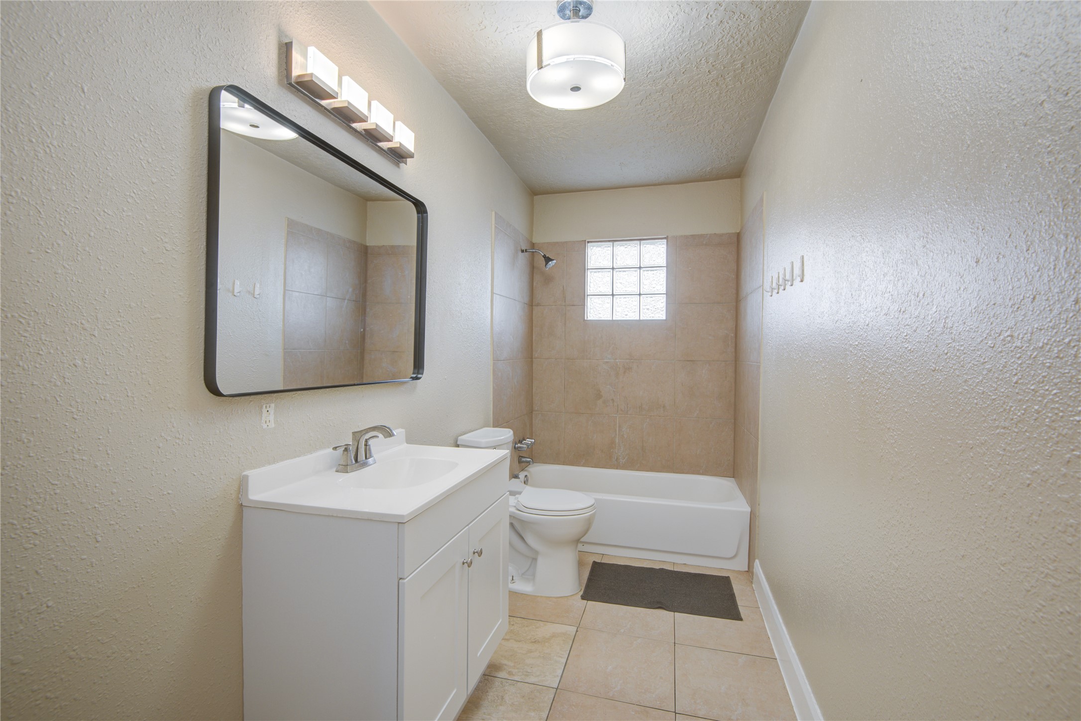 14450 Victoria Street Houston, TX 77015 - Photo 12 of 19 a bathroom with a sink a toilet and mirror
