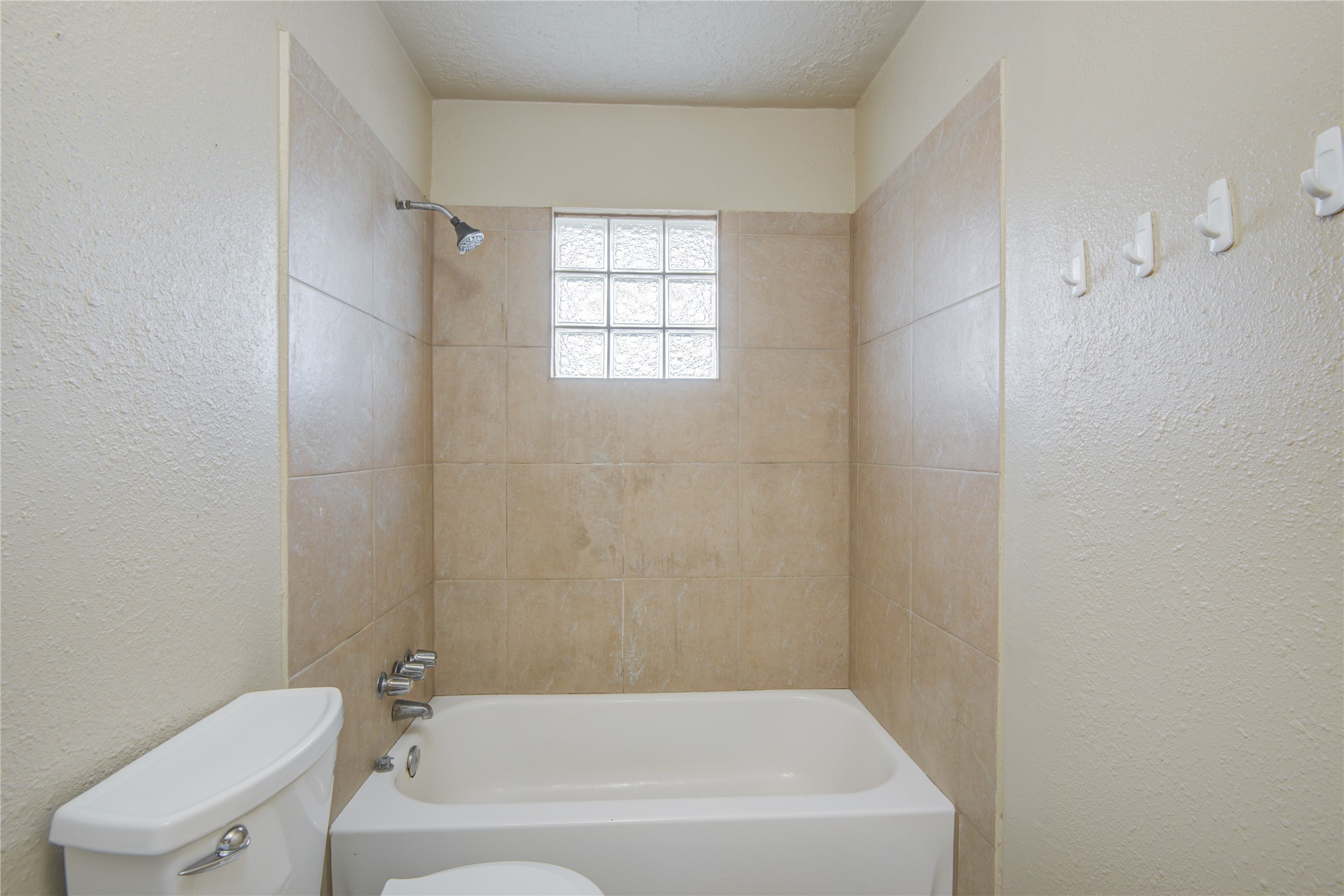14450 Victoria Street Houston, TX 77015 - Photo 13 of 19 a white bath tub sitting next to a toilet