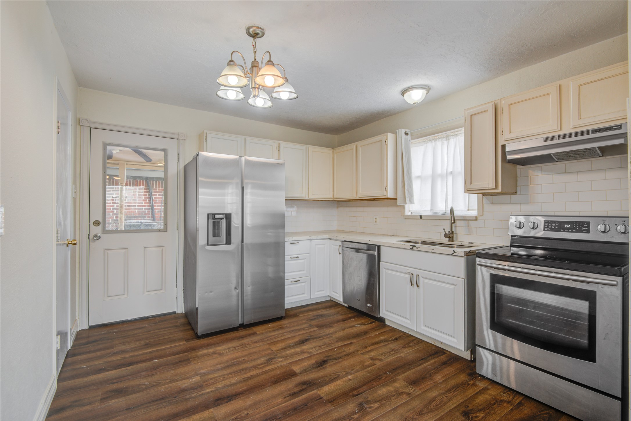 14450 Victoria Street Houston, TX 77015 - Photo 14 of 19 a kitchen with a refrigerator stove and microwave