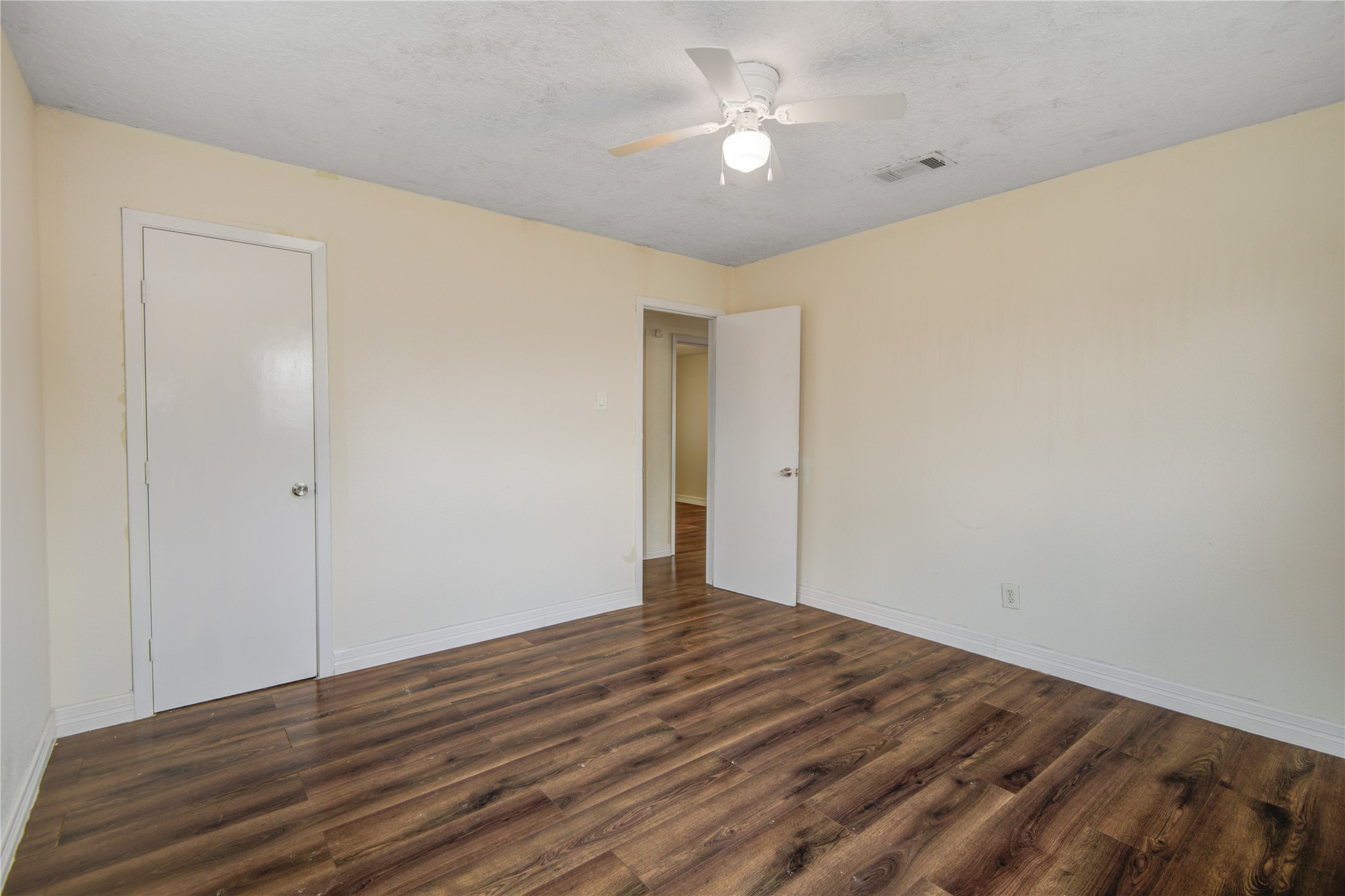 14450 Victoria Street Houston, TX 77015 - Photo 18 of 19 a view of room with wooden floor and fan