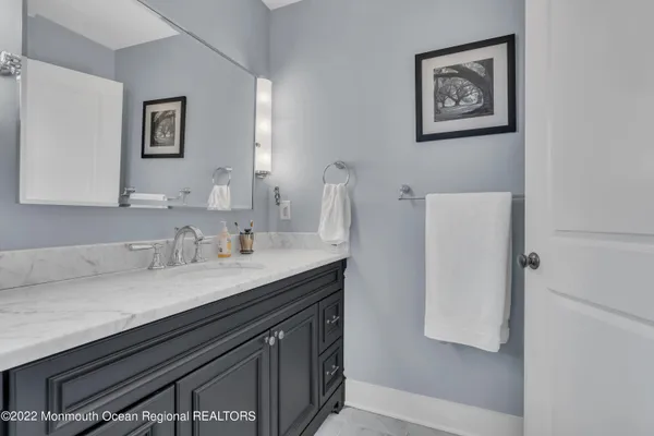 a bathroom with a sink and a mirror
