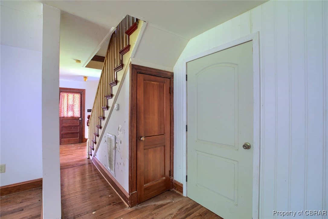 708 Calthrop Neck Road Yorktown, VA 23693 - Photo 12 of 24 Hall with wood finished floors and stairway