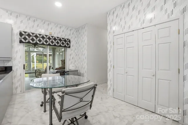 a building outdoor space with patio furniture and potted plants