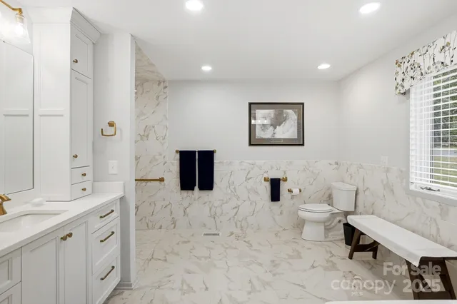 a view of a hallway to closet and utility room