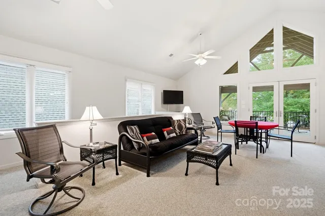 a kitchen with stainless steel appliances a stove a sink a microwave a refrigerator and cabinets