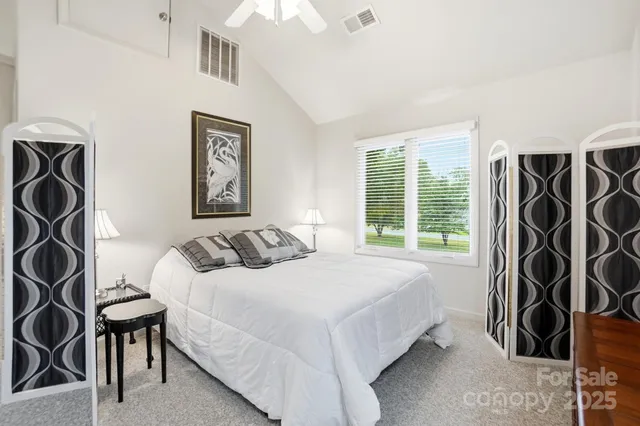 a bathroom with a shower a toilet and a shower