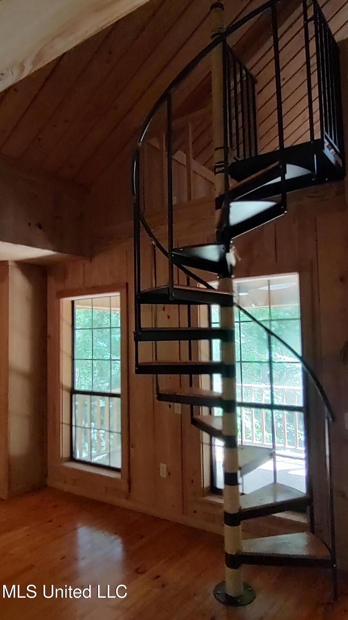 110 Rosenbaum Drive Poplarville, MS 39470 - Photo 11 of 39 Stairs to 1st loft area