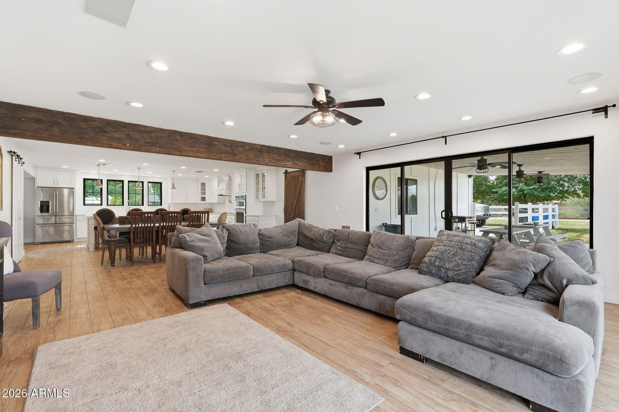 2858 East Redfield Road Gilbert, AZ 85234 - Photo 23 of 60 a living room with furniture ceiling fan and a large window