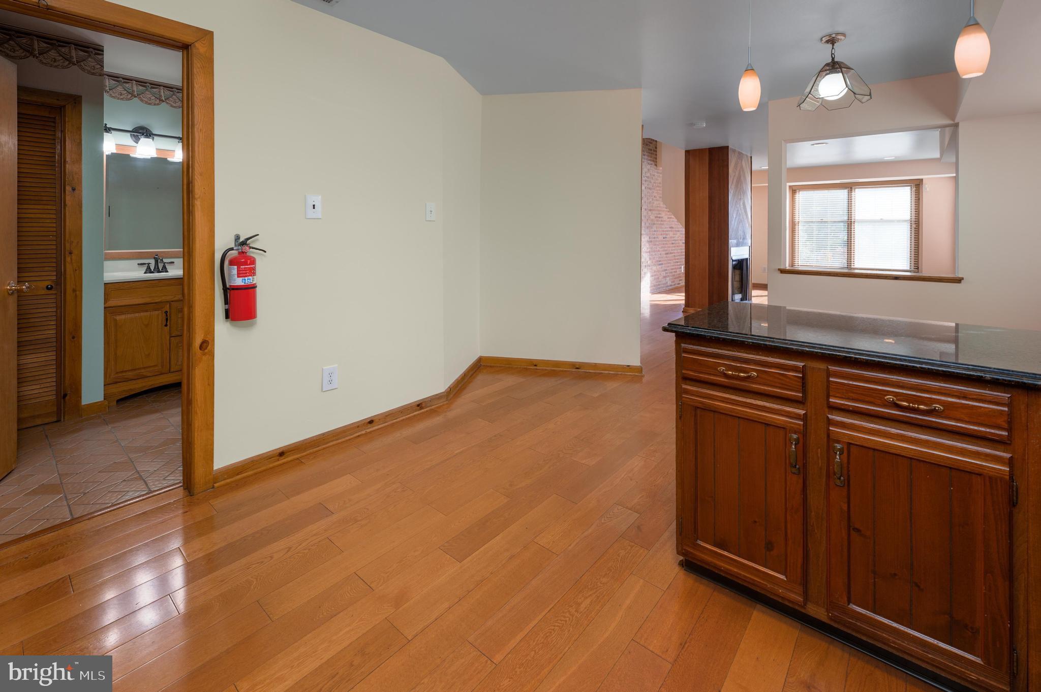 23 South Main Street, Unit 3 Medford, NJ 08055 - Photo 10 of 26 a view of a hallway with wooden floor and cabinet