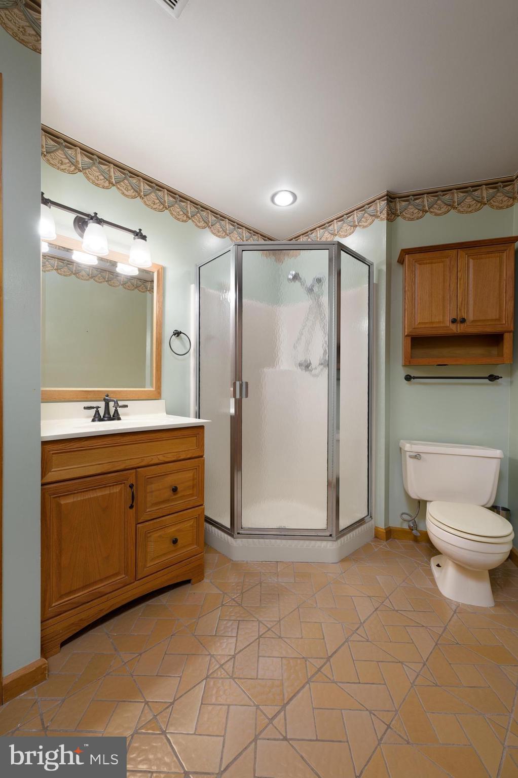 23 South Main Street, Unit 3 Medford, NJ 08055 - Photo 11 of 26 a spacious bathroom with a granite countertop sink mirror and toilet