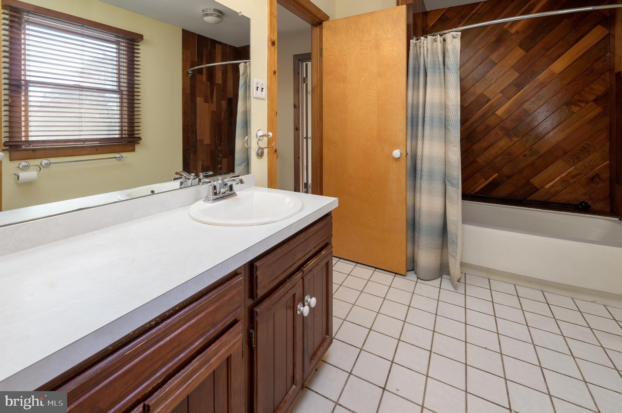 23 South Main Street, Unit 3 Medford, NJ 08055 - Photo 17 of 26 a bathroom with a sink and a mirror