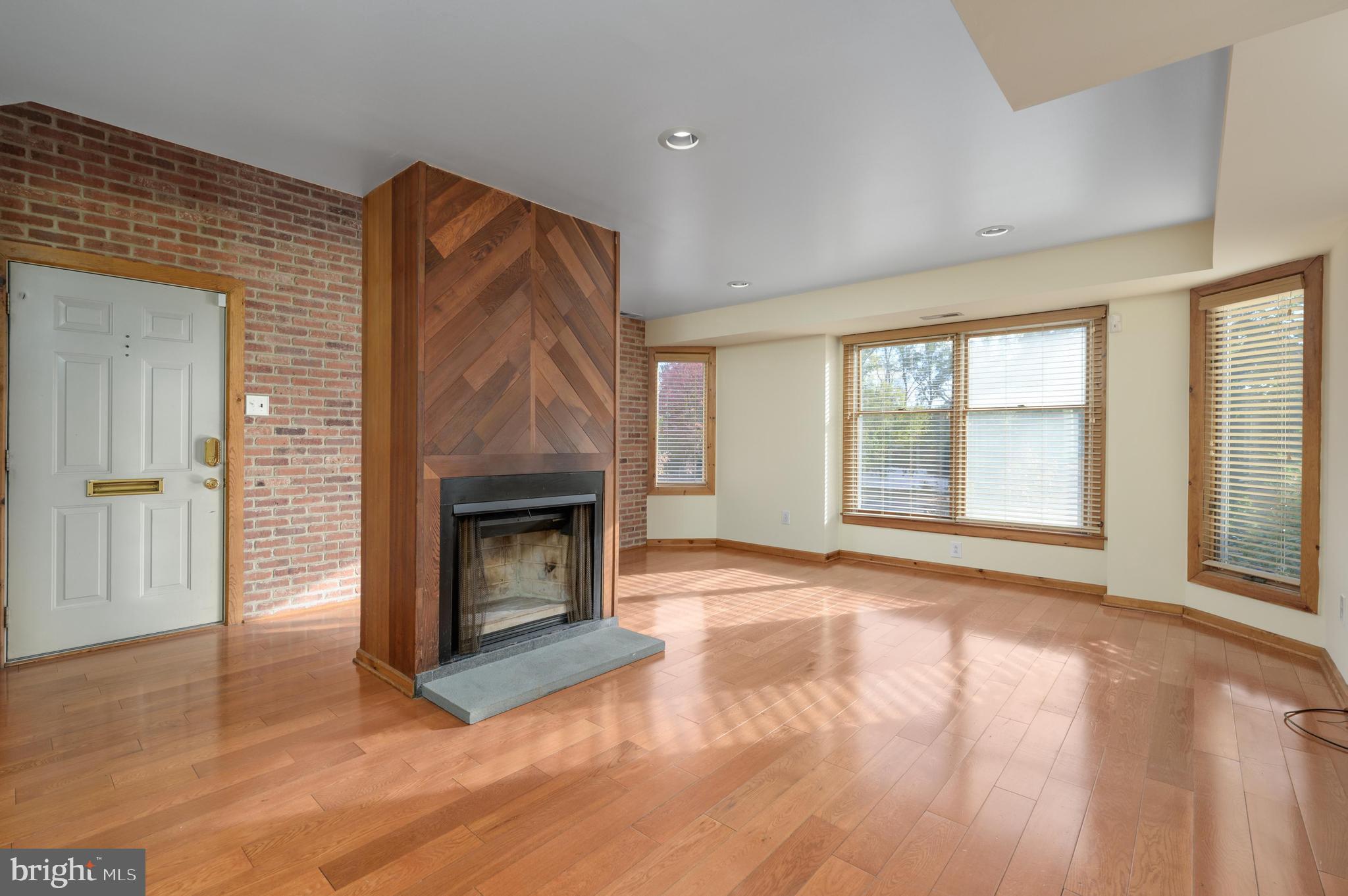 23 South Main Street, Unit 3 Medford, NJ 08055 - Photo 3 of 26 a view of an empty room with a fireplace and a window