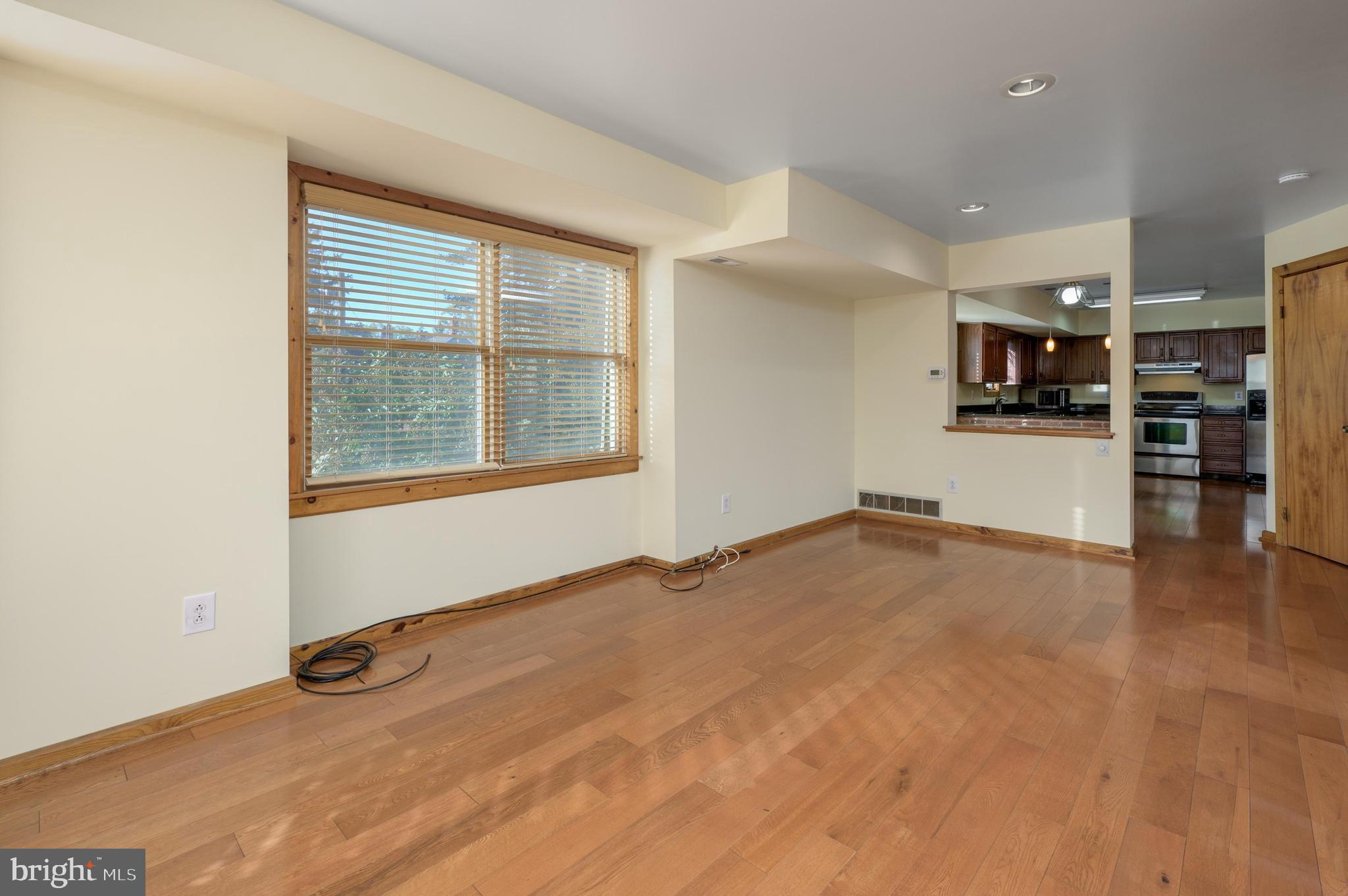23 South Main Street, Unit 3 Medford, NJ 08055 - Photo 6 of 26 an empty room with a empty space and windows