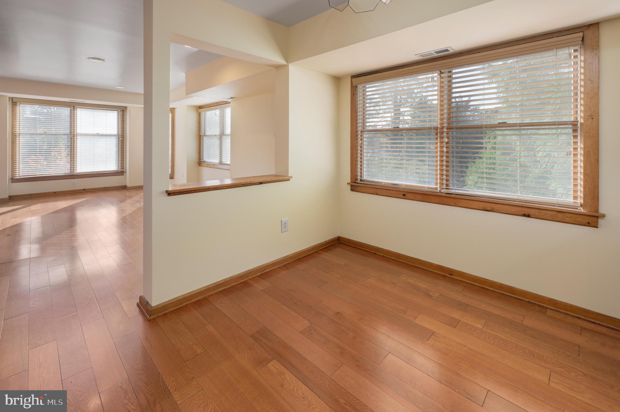23 South Main Street, Unit 3 Medford, NJ 08055 - Photo 7 of 26 a view of an empty room with wooden floor and a window